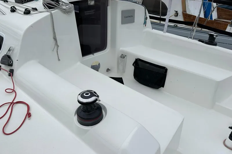 Slide: The Image of 2021 J Boats J99 cockpit with winch, ropes, and Garmin equipment. - 8