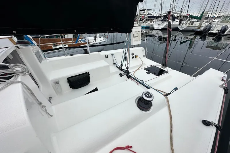 Slide: The Image of 2021 J Boats J99 sailboat cockpit with winch and rigging, docked at marina. - 9