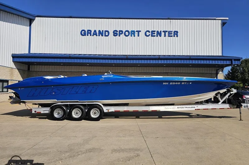 The Image of 2002 Hustler 388 SLINGSHOT boat on trailer at Grand Sport Center. - 1