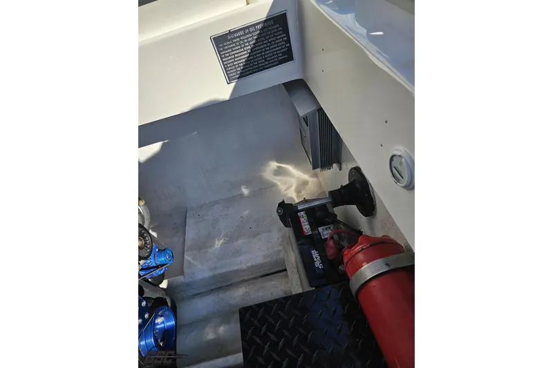 Slide: The Image of Interior of 2002 Hustler 388 SLINGSHOT boat showing equipment and safety features. - 102