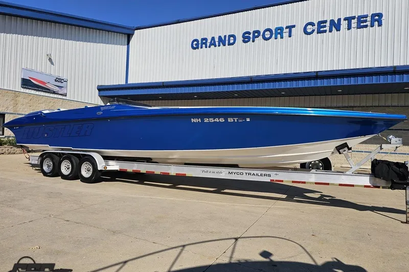 Slide: The Image of 2002 Hustler 388 SLINGSHOT boat on trailer at Grand Sport Center. - 13