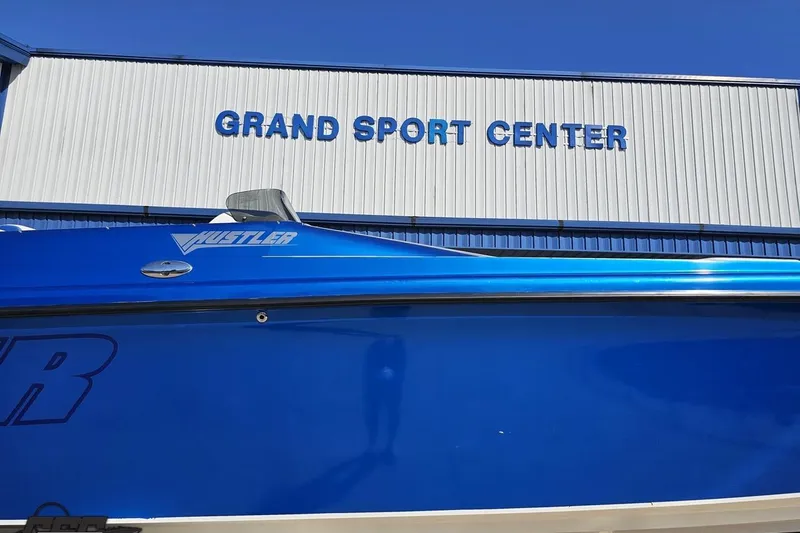 Slide: The Image of Blue 2002 Hustler 388 SLINGSHOT boat at Grand Sport Center. - 3
