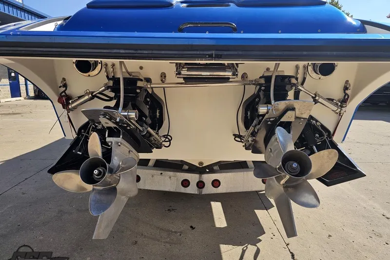 Slide: The Image of Rear view of 2002 Hustler 388 SLINGSHOT boat showing dual propellers and drive system. - 35