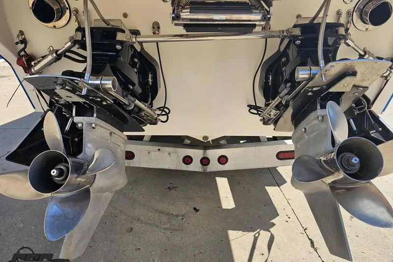 Slide: The Image of Dual propellers of a 2002 Hustler 388 SLINGSHOT boat on a trailer. - 36
