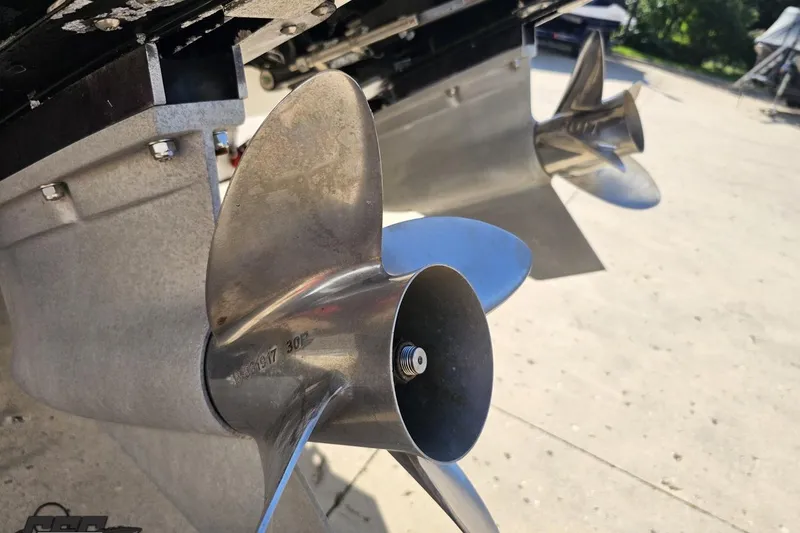 Slide: The Image of Close-up of 2002 Hustler 388 SLINGSHOT boat propellers on a sunny day. - 37
