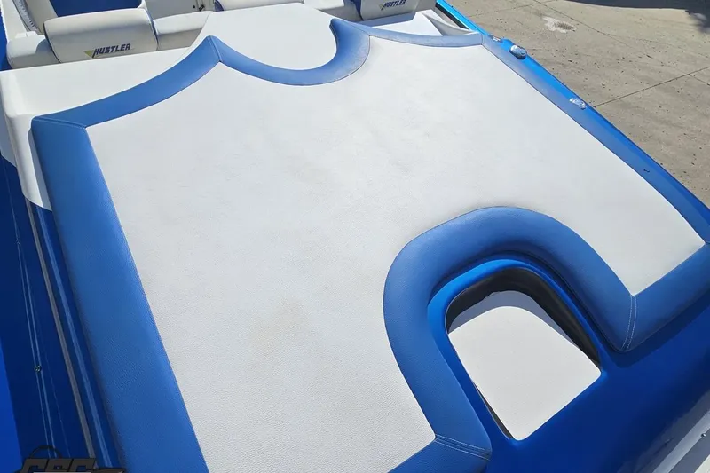 Slide: The Image of 2002 Hustler 388 SLINGSHOT boat with blue and white upholstery detail. - 40