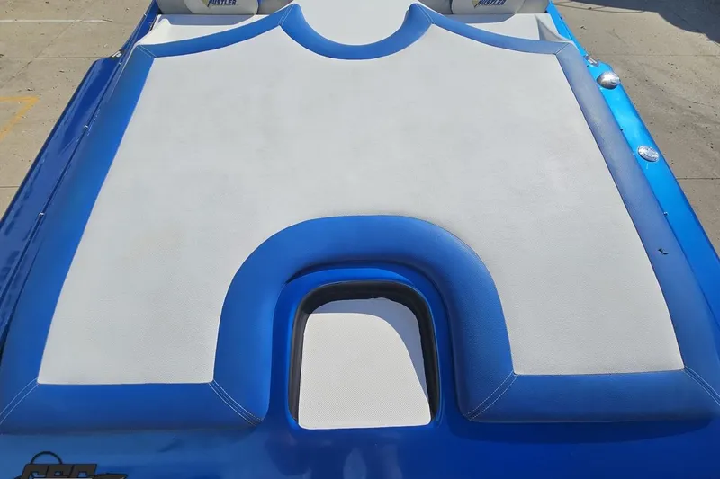 Slide: The Image of 2002 Hustler 388 SLINGSHOT boat deck with blue and white upholstery. - 44