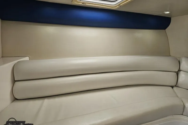 Slide: The Image of 2002 Hustler 388 SLINGSHOT interior with beige leather seating and blue accent. - 75
