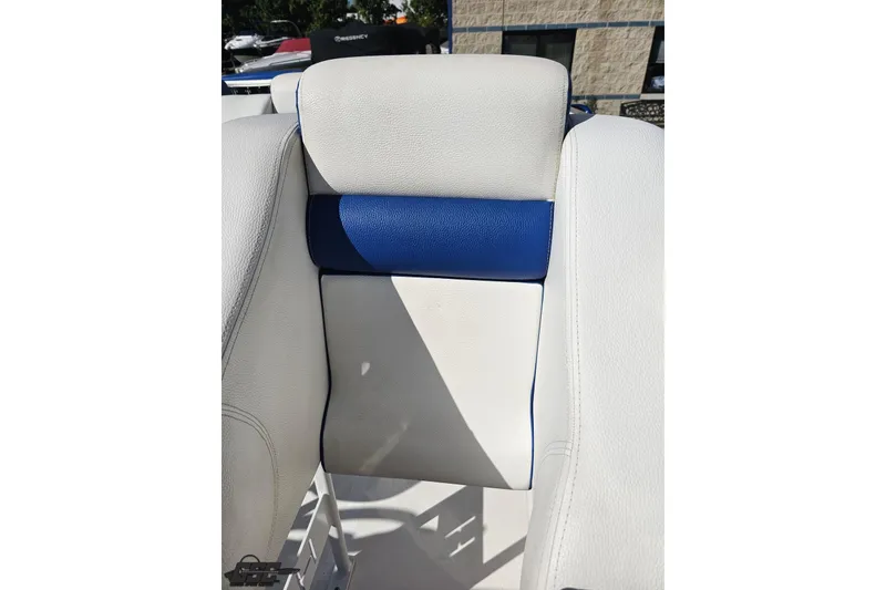 Slide: The Image of White and blue seat detail of 2002 Hustler 388 SLINGSHOT boat. - 84