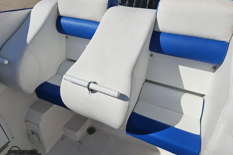 Slide: The Image of White and blue seating in 2002 Hustler 388 SLINGSHOT boat interior. - 92
