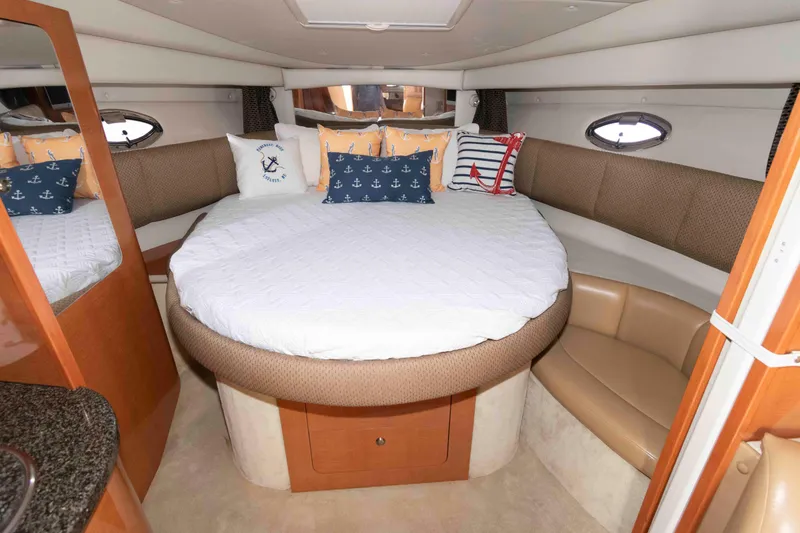 Slide: The Image of Luxurious 2007 Chaparral Signature 350 cabin interior with cozy round bed and nautical decor. - 14