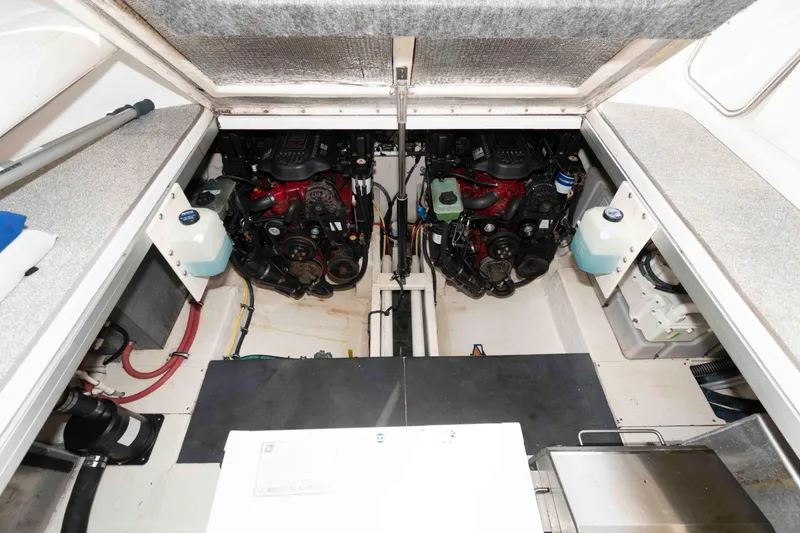Slide: The Image of Engine compartment of 2007 Chaparral Signature 350 boat, showcasing dual engines and components. - 18