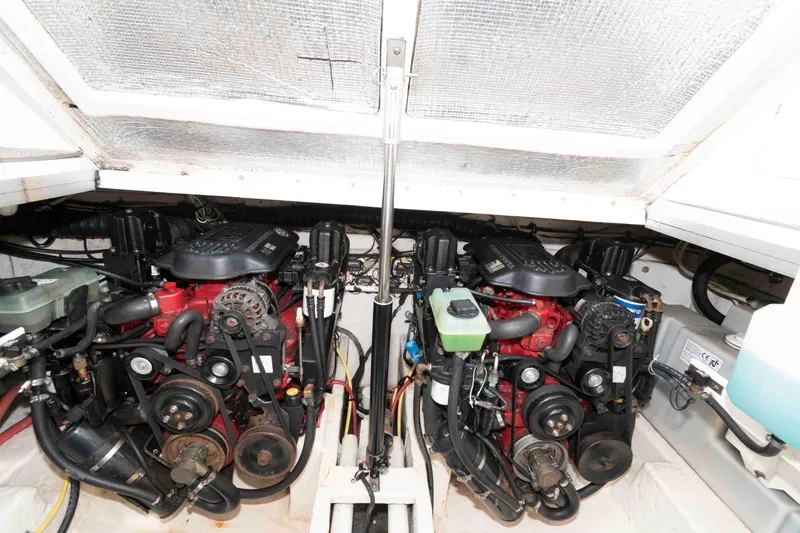 Slide: The Image of Engine compartment of 2007 Chaparral Signature 350 boat, featuring dual engines and mechanical components. - 19