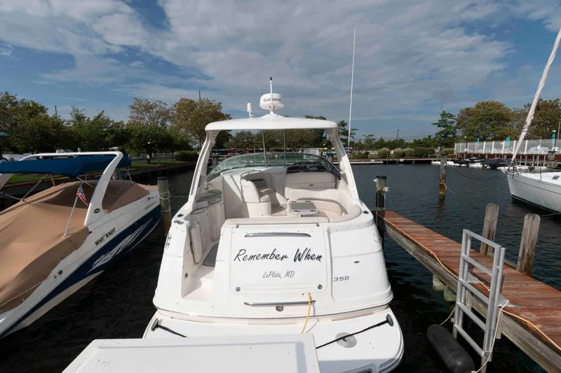 Slide: The Image of 2007 Chaparral Signature 350 boat docked at marina under cloudy sky. - 2