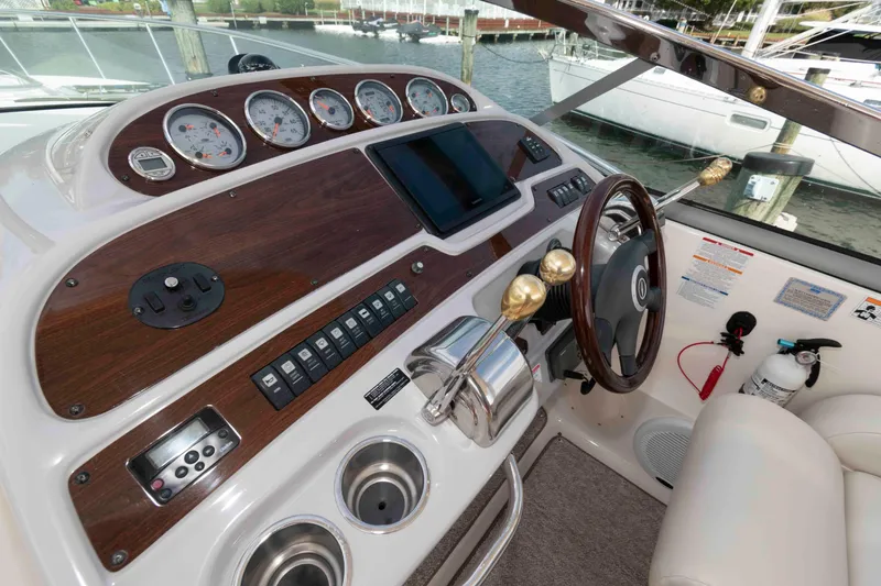 Slide: The Image of 2007 Chaparral Signature 350 boat dashboard with gauges, controls, and steering wheel. - 6