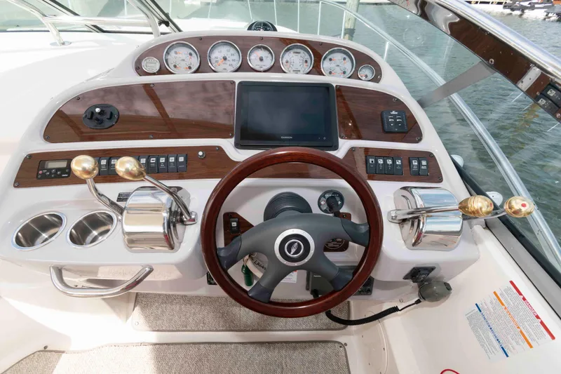 Slide: The Image of 2007 Chaparral Signature 350 helm with wood accents and modern controls. - 7