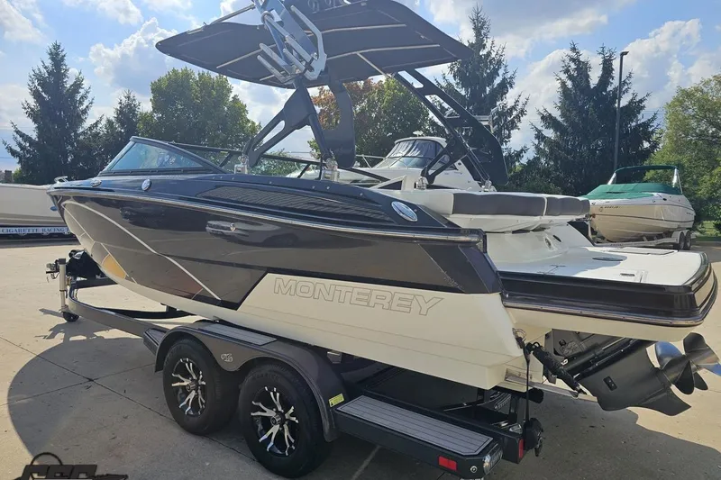 Slide: The Image of 2018 Monterey 238SS Super Sport boat on trailer, parked outdoors. - 13