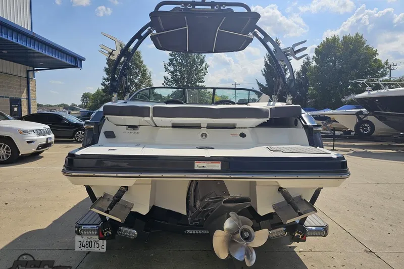 Slide: The Image of 2018 Monterey 238SS Super Sport boat, rear view, parked outdoors on a sunny day. - 14