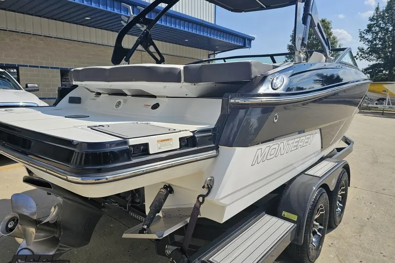 Slide: The Image of 2018 Monterey 238SS Super Sport boat on trailer, rear view, outdoors. - 17