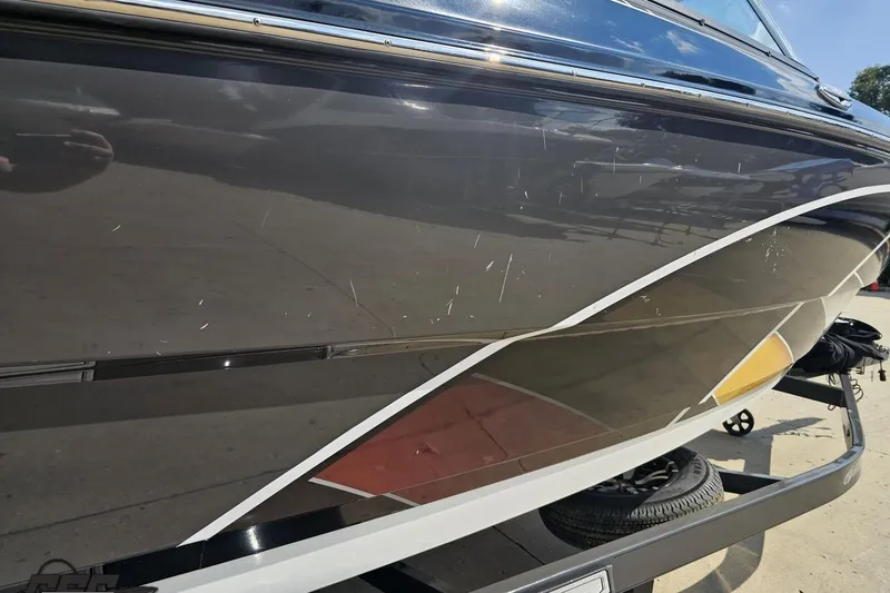 Slide: The Image of 2018 Monterey 238SS Super Sport boat with visible scratches on the hull. - 20