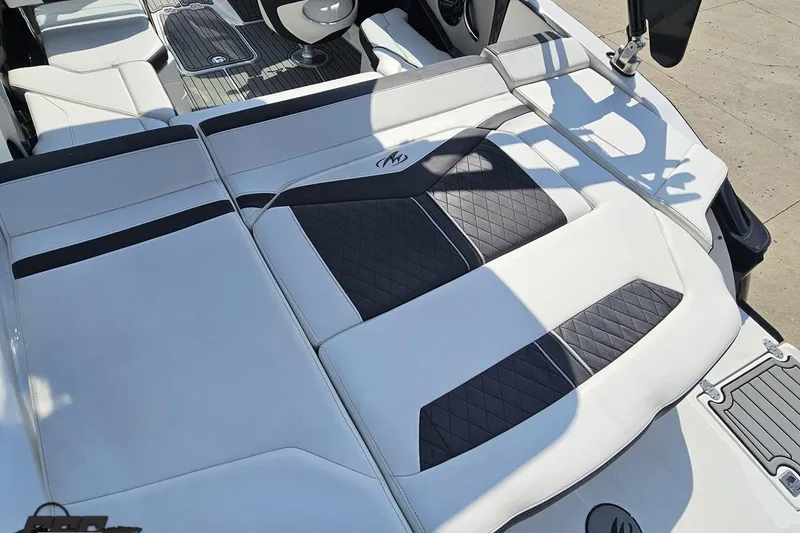 Slide: The Image of 2018 Monterey 238SS Super Sport boat interior with white and black seating. - 30