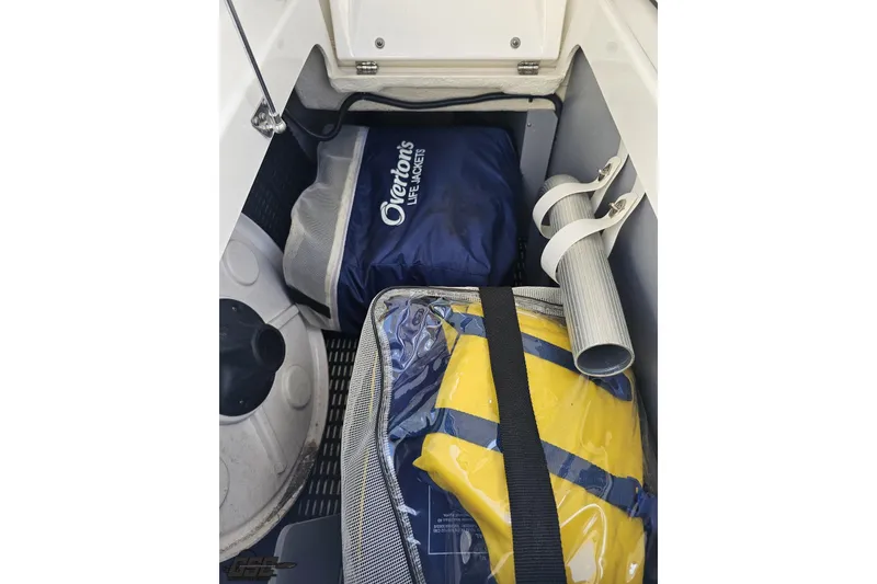 Slide: The Image of Storage compartment in 2018 Monterey 238SS Super Sport with life jackets and accessories. - 35