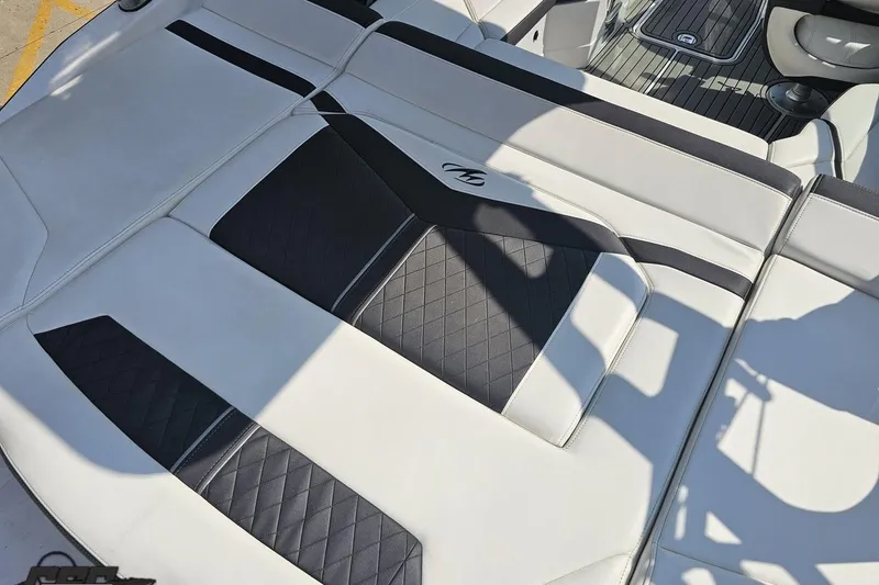 Slide: The Image of 2018 Monterey 238SS Super Sport boat interior with black and white cushioned seating. - 36