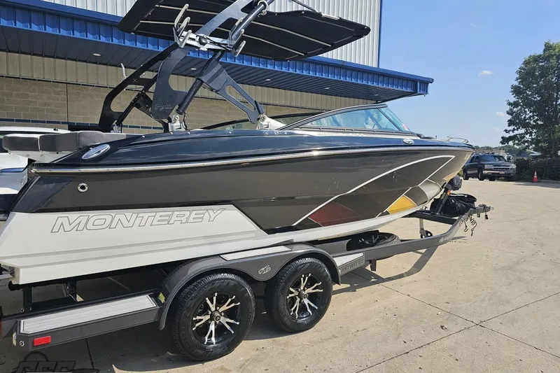 Slide: The Image of 2018 Monterey 238SS Super Sport boat on trailer, parked outdoors. - 4