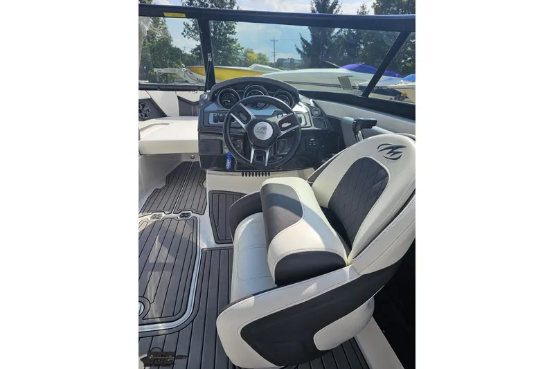 Slide: The Image of 2018 Monterey 238SS Super Sport boat interior with steering wheel and seating. - 50