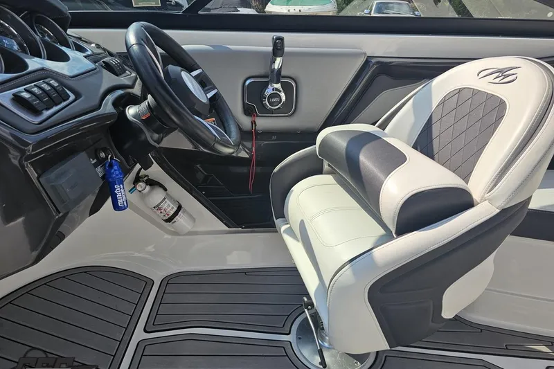 Slide: The Image of Interior of 2018 Monterey 238SS Super Sport boat with steering wheel and captain's chair. - 51