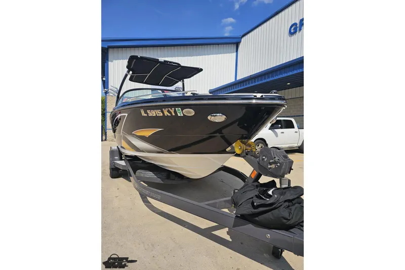 Slide: The Image of 2018 Monterey 238SS Super Sport boat on trailer, parked outside a building. - 6