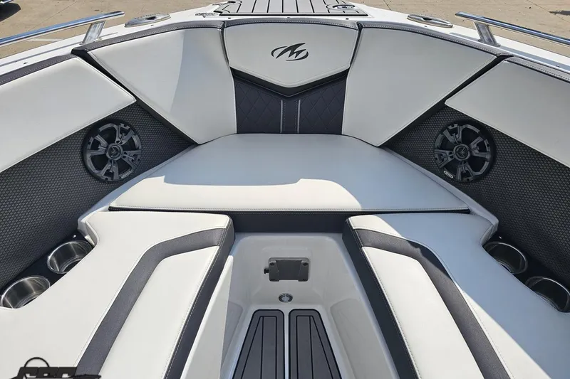Slide: The Image of 2018 Monterey 238SS Super Sport boat interior with cushioned seating and built-in speakers. - 60