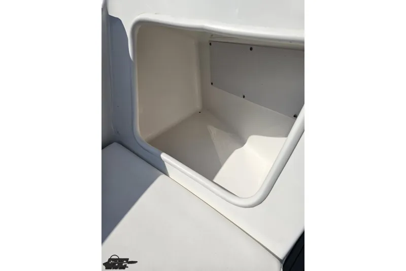 Slide: The Image of Storage compartment in 2018 Monterey 238SS Super Sport boat, featuring white interior design. - 62