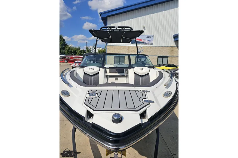 Slide: The Image of 2018 Monterey 238SS Super Sport boat with sleek design, docked outdoors under blue sky. - 7