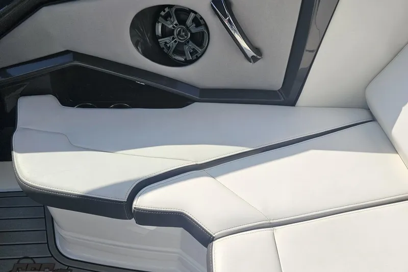 Slide: The Image of 2018 Monterey 238SS Super Sport boat interior with sleek white seating and speaker detail. - 70
