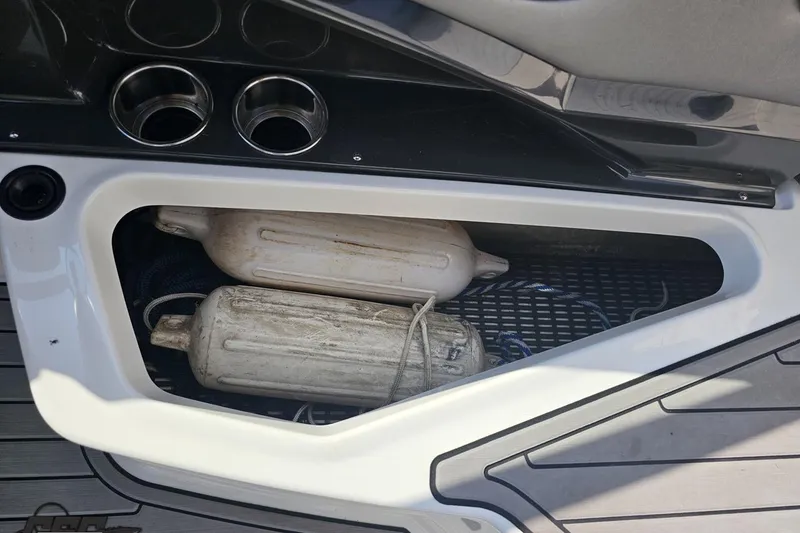 Slide: The Image of Storage compartment with fenders on a 2018 Monterey 238SS Super Sport boat. - 71
