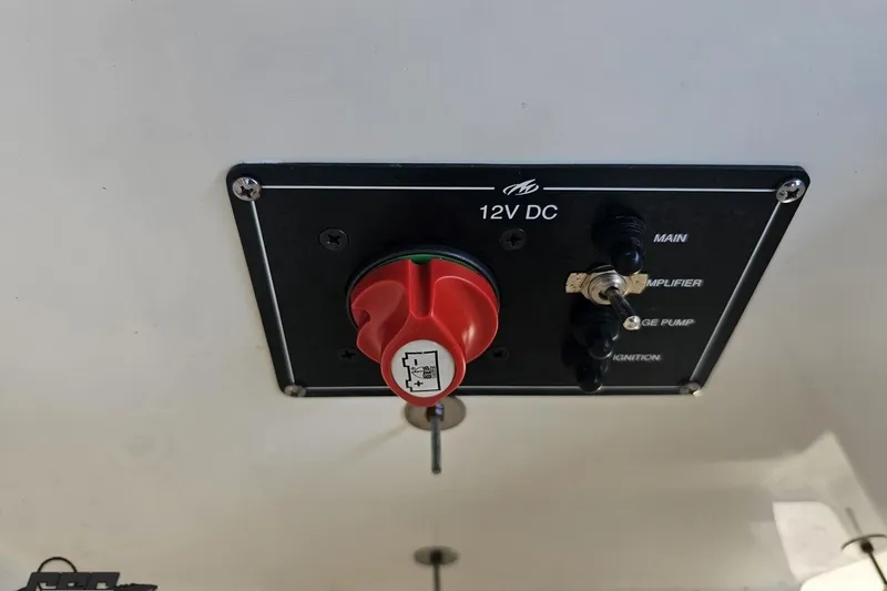 Slide: The Image of 2018 Monterey 238SS Super Sport 12V DC control panel with switches and red knob. - 74