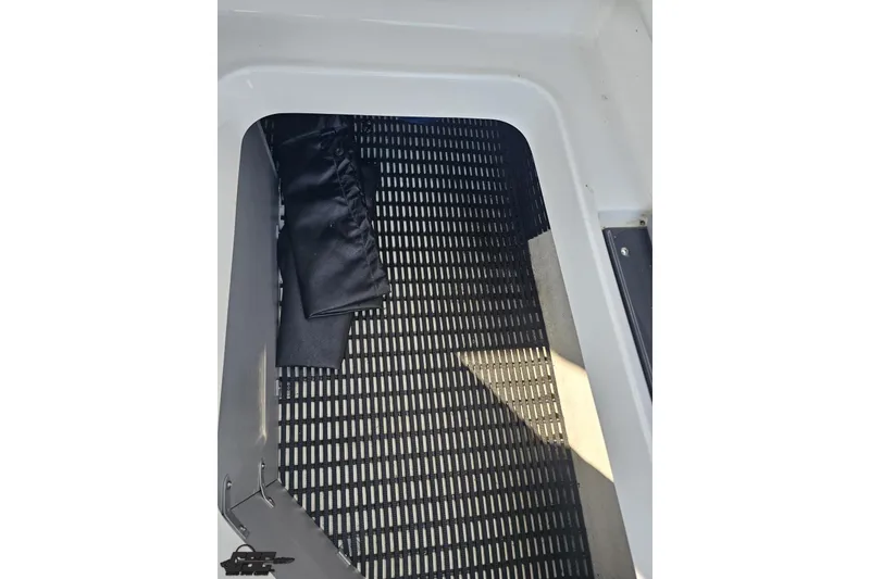 Slide: The Image of Interior view of 2018 Monterey 238SS Super Sport boat with black flooring. - 76