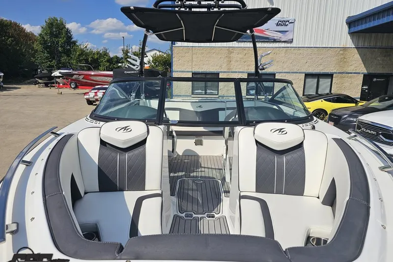 Slide: The Image of 2018 Monterey 238SS Super Sport boat with sleek interior design at a dealership. - 8