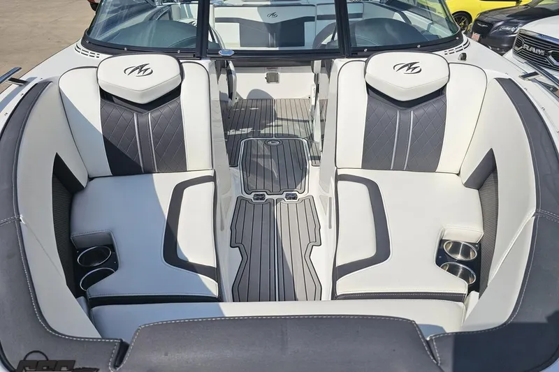 Slide: The Image of 2018 Monterey 238SS Super Sport boat interior with stylish seating and cup holders. - 9