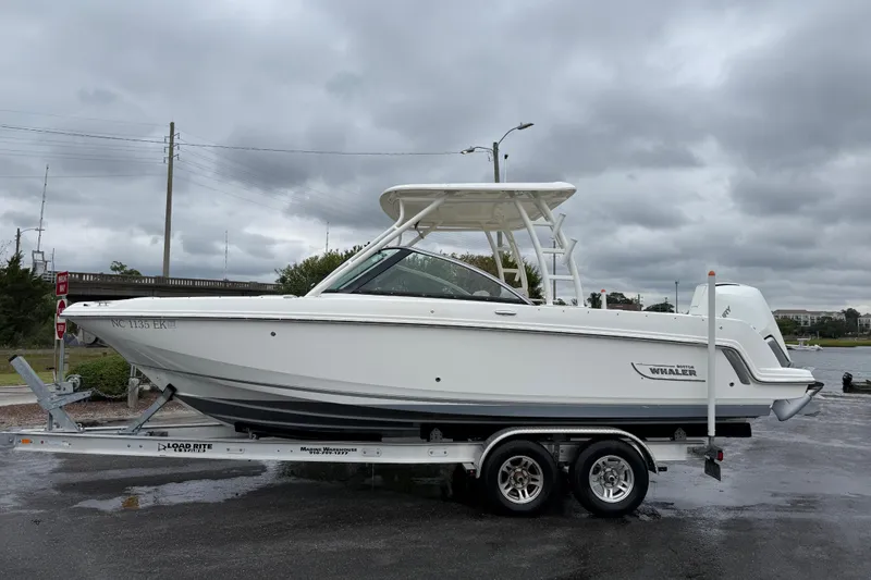 Slide: The Image of 2019 Boston Whaler 230 Vantage boat cruising on a calm lake. - 1