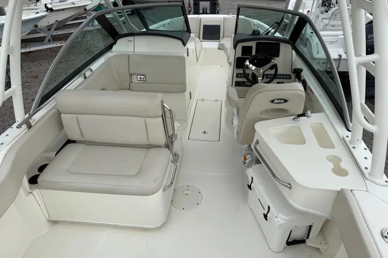 Slide: The Image of 2019 Boston Whaler 230 Vantage boat with swim ladder and storage compartment. - 11