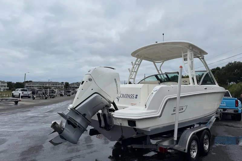 Slide: The Image of 2019 Boston Whaler 230 Vantage boat cruising on open water. - 6