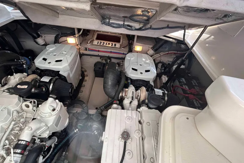 Slide: The Image of Engine room of 2008 Sea Ray 38 Sundancer with dual engines and mechanical components. - 14