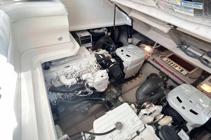 Slide: The Image of Engine room of a 2008 Sea Ray 38 Sundancer, showcasing dual engines and mechanical components. - 15