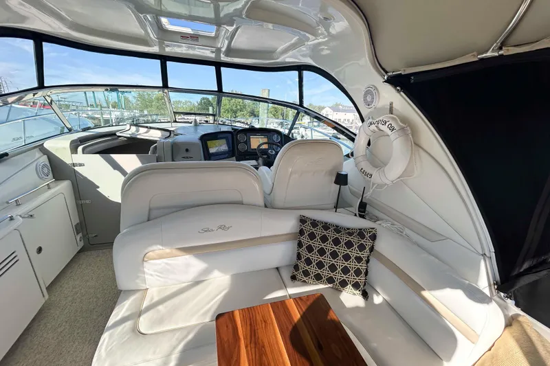 Slide: The Image of Luxurious interior of 2008 Sea Ray 38 Sundancer yacht with plush seating and helm. - 3