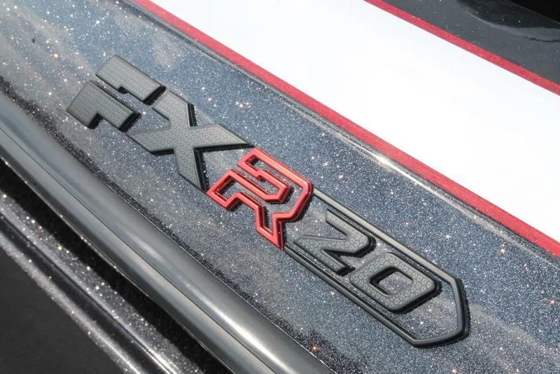 Slide: The Image of 2026 Skeeter FXR20 FLEX logo on glittery surface with red accents. - 12