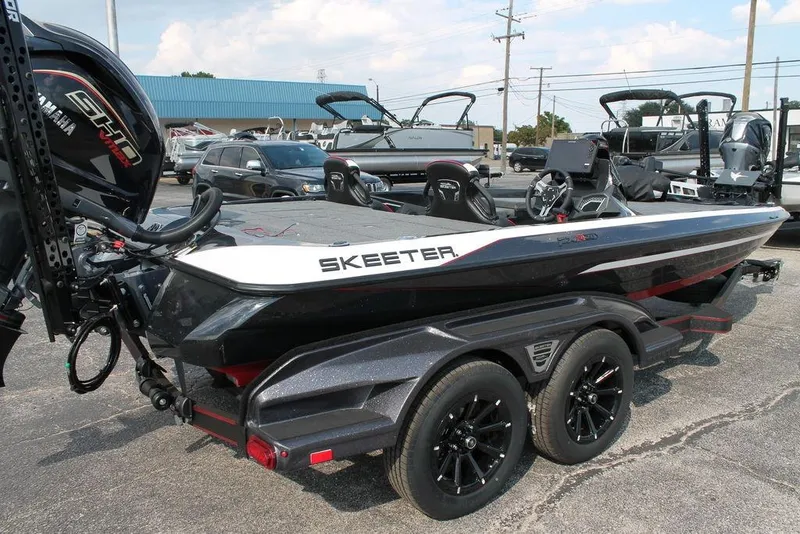 Slide: The Image of 2026 Skeeter FXR20 FLEX boat on trailer, featuring sleek design and Yamaha engine. - 6