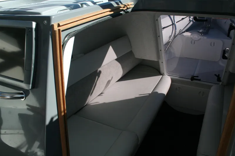 Slide: The Image of Interior cockpit of 2012 Protector Targa 30 boat with steering wheel and navigation screens. - 10