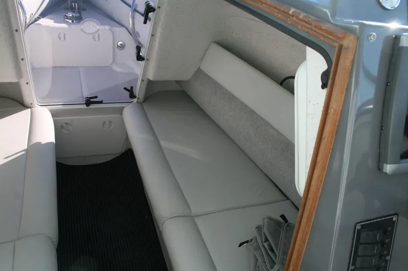 Slide: The Image of Interior of 2012 Protector Targa 30 boat with cushioned seating and modern design. - 11